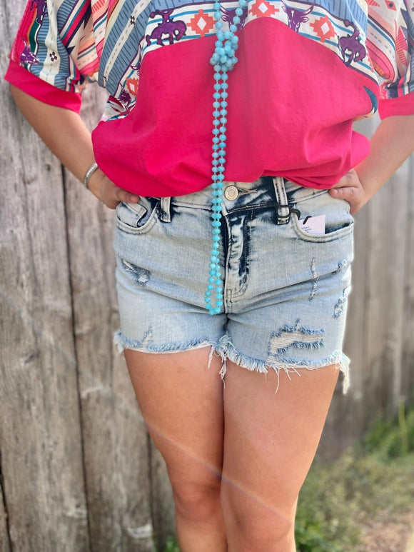 Distressed washed denim shorts