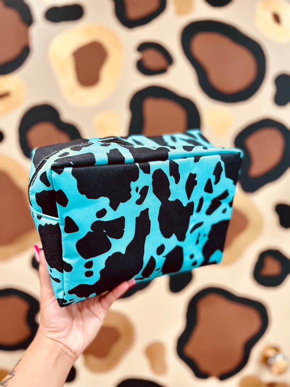 Turquoise cow print makeup bag/travel bag
